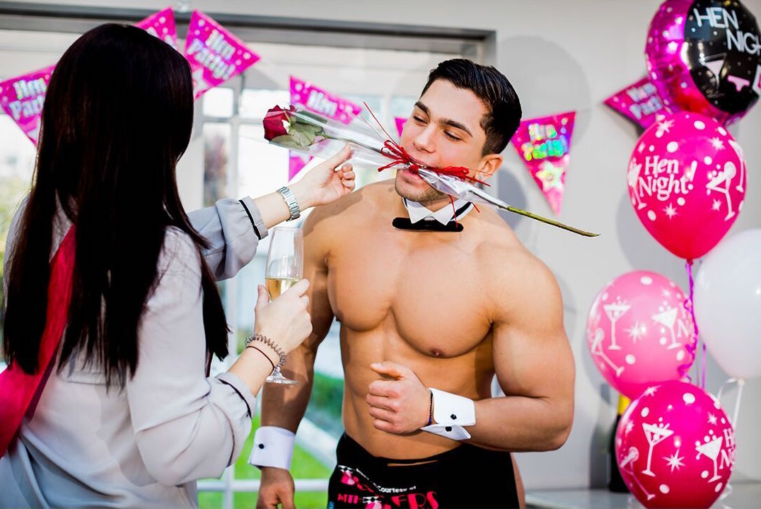 Butlers with Bums butler with a rose hen party game being played by butler and hen