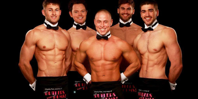 Topless Butlers posing for a photo