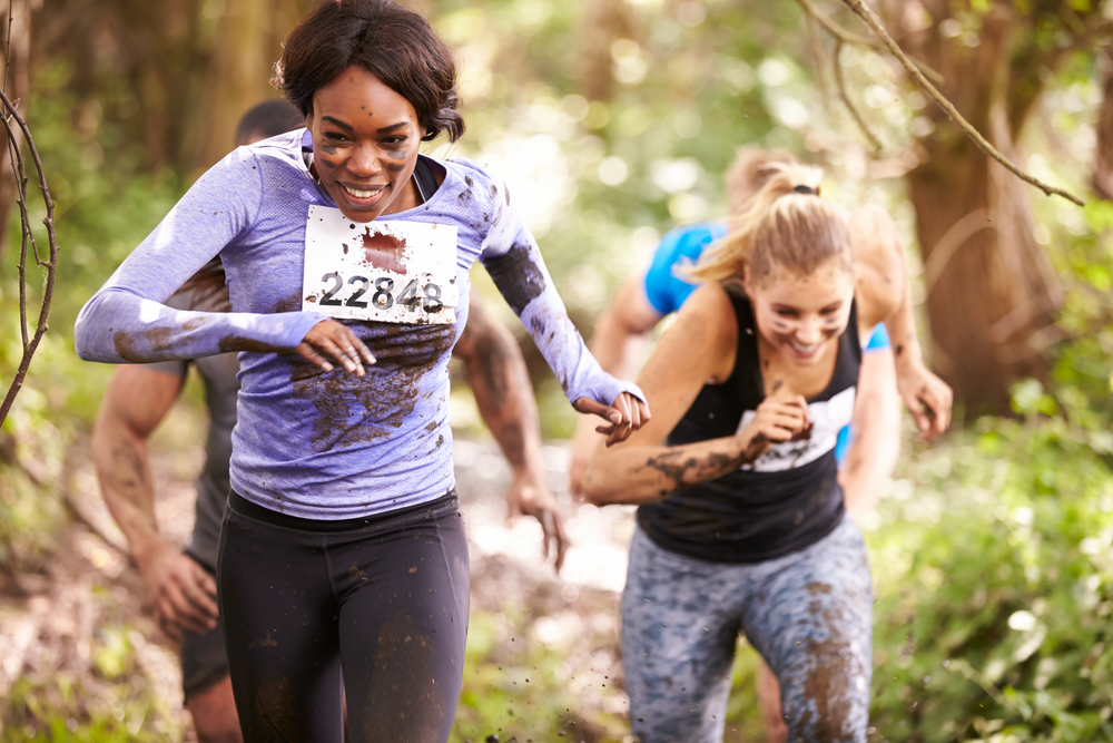 Unique hen party activity where two women run in an assault course